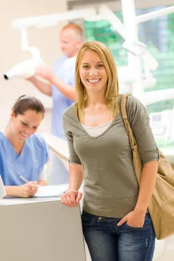 smiling woman at desk